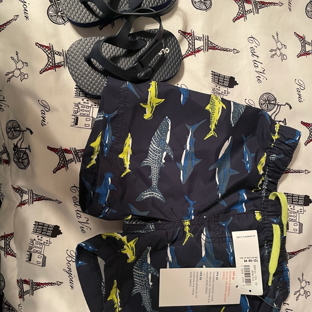 Old navy swimming trunks and beach sandals
